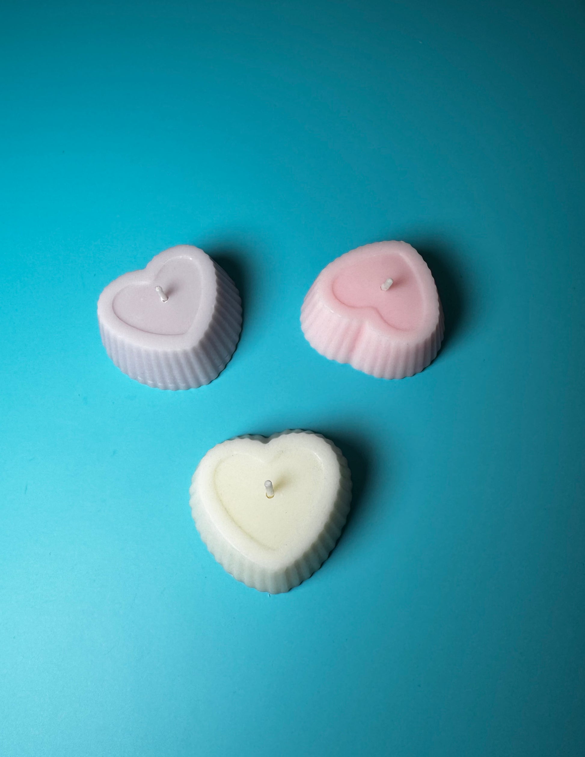 bomboniere candele cuoricino messe in varie posizioni